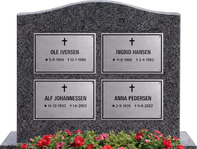 Lasergraverte minneplater i stål montert på gravminne